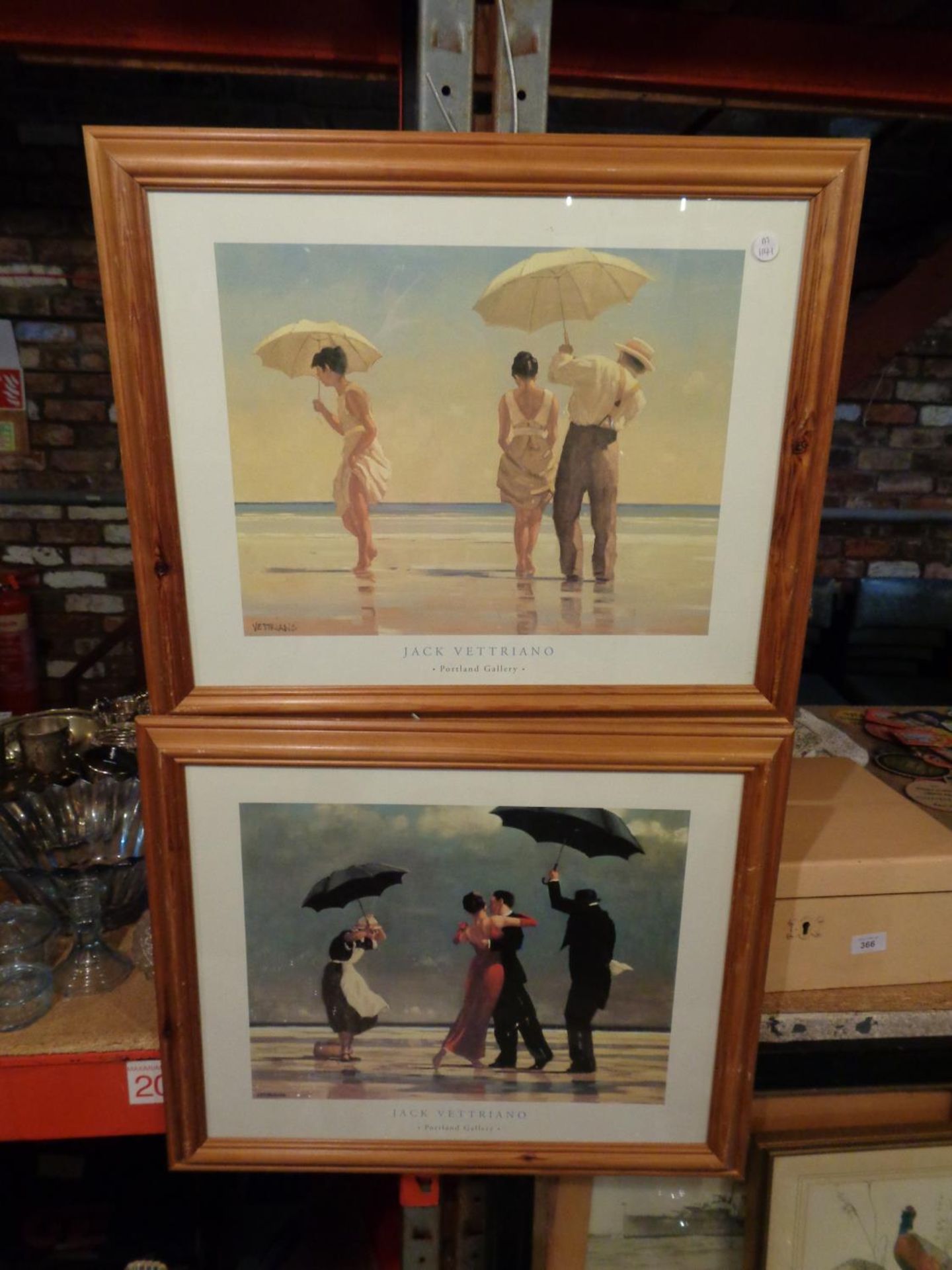 TWO FRAMED PRINTS BY JACK VETTRIANO DEPICTING SCENES OF PEOPLE DANCING ON A BEACH