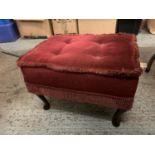 A VINTAGE FOOTSTOOL WITH RED VELVET UPHOLSTERY