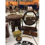 A MAHOGANY SWIVEL DRESSING TABLE MIRROR, A HEAVILY CARVED TRIPOD TABLE WITH INLAY, AN ONYX LIDDED