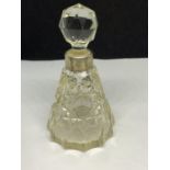 A CUT GLASS PERFUME BOTTLE WITH A HALLMARKED BIRMINGHAM 1931 SILVER COLLAR MAKER SML