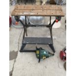 A PETROL CHAINSAW AND A FOLDING WORK BENCH