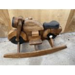 A WOODEN CHILDRENS ROCKING MOTORBIKE