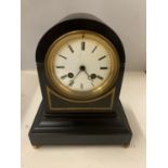 AN EARLY 19TH CENTURY FRENCH SLATE MANTLE CLOCK WITH ENAMEL FACE AND ROMAN NUMERALS