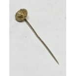 A VICTORIAN 15 CARAT GOLD SEED PEARL STICK PIN GROSS WEIGHT 2 GRAMS IN A PRESENTATION BOX