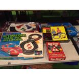 A QUANTITY OF TOYS TO INCLUDE, A BOXED RADIO SHACK SCALEXTRIC STYLE RACING TRACK, A POWER TRACK