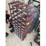 A WOODEN AND METAL 44 BOTTLE WINE RACK