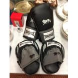 A PAIR OF LONSDALE BOXING GLOVES AND A PAIR OF SPARRING PADS