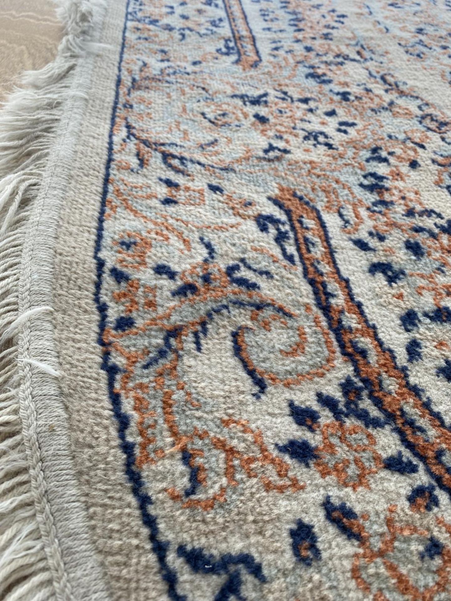 AN OVAL CREAM PATTERNED RUG - Image 3 of 3