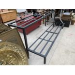 A WROUGHT IRON TWO TIER DISPLAY STAND (L:150CM)
