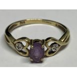 A 9 CARAT GOLD RING WITH A RECTANGULAR AMETHYST CENTRE STONE AND A DIAMOND EACH SIDE ON HEART DESIGN
