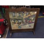 A WOODEN FIRE SCREEN WITH DECORATIVE TAPESTRY VICTORIAN STREET SCENE