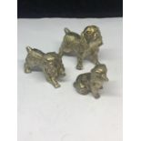 THREE WHITE METAL DOG FIGURES