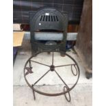 A VINTAGE CAST IRON FIRE FRONT AND A CAST IRON HANGING FRAME