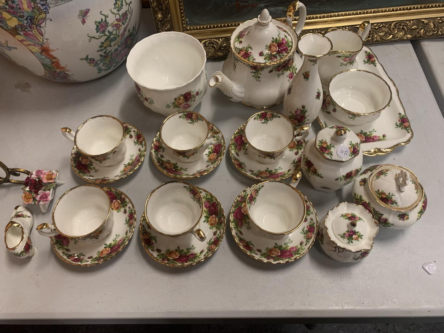 TWENTY TWO PIECES OF ROYAL ALBERT OLD COUNTRY ROSES TO INCLUDE SIX CUPS AND SAUCERS, TEAPOT, MILK