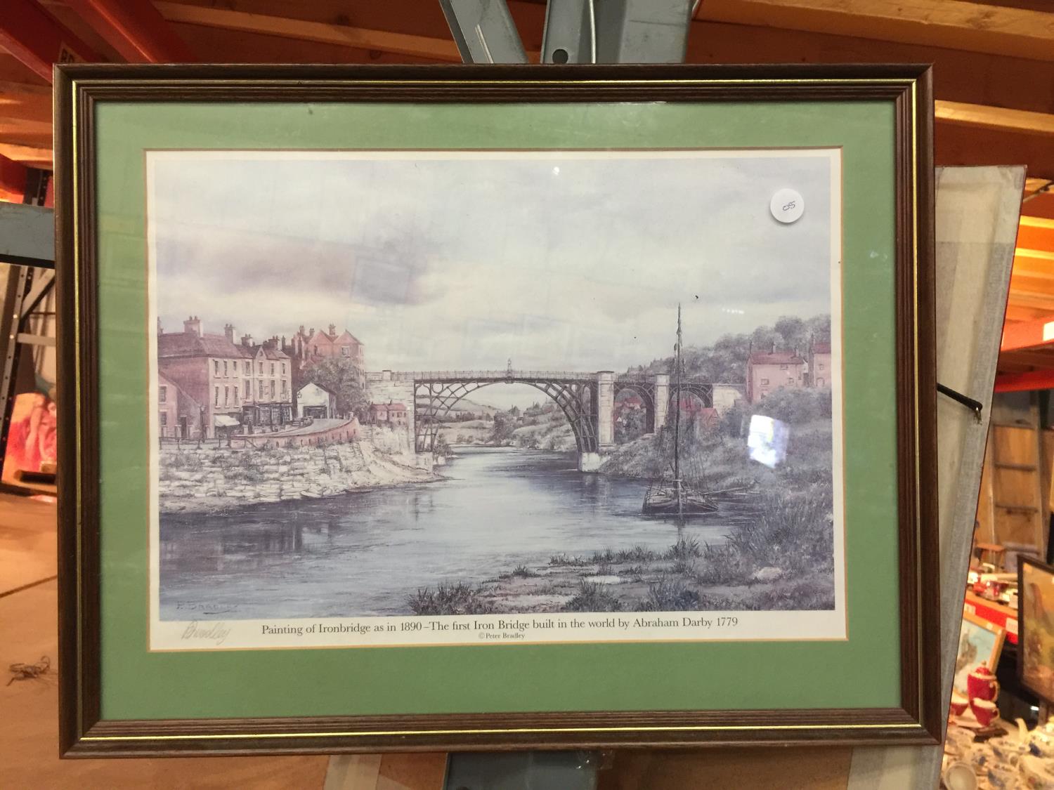 A FRAMED LIMITED EDITION PRINT OF IRONBRIDGE SIGNED PETER BRADLEY