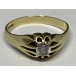 A 9 CARAT GOLD RING WITH A CLEAR STONE GROSS WEIGHT 3.8 GRAMS