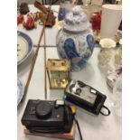 AN ORIENTAL STYLE LIDDED GINGER JAR, MARKED TO BASE, VARIOUS CAMERAS AND AN H. SAMUEL BRASS CARRIAGE