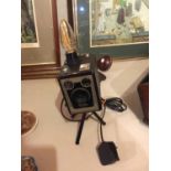 A BOX BROWNIE CAMERA ON TRIPOD STAND CONVERTED TO A LAMP