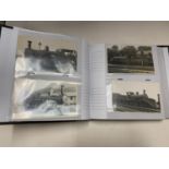 A PHOTOGRAPH ALBUM WITH PICTURES OF TRAINS, ROYAL POSTCARDS, ETC