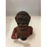 A VINTAGE CAST MECHANICAL 'JOLLY MAN' MONEY BOX WITH MOVING EYES