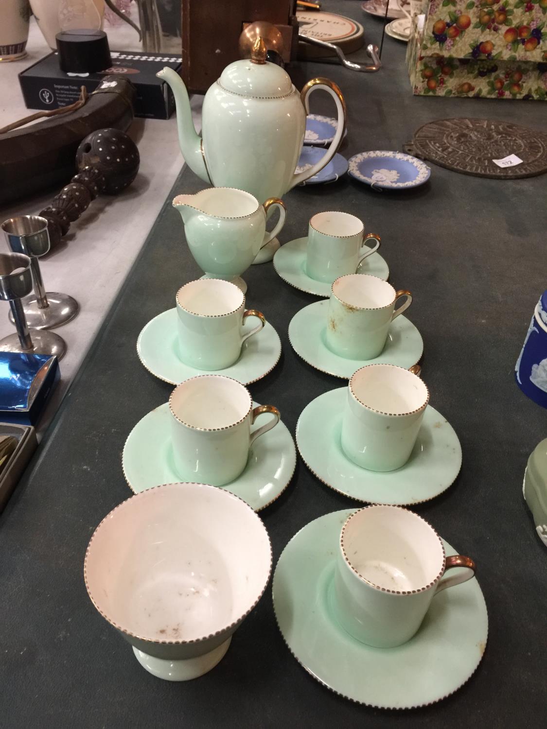 A QUANTITY OF WEDGWOOD LIME GREEN WITH GILDING TO INCLUDE, COFFEE CANS, SAUCERS, TEAPOT, CREAM JUG
