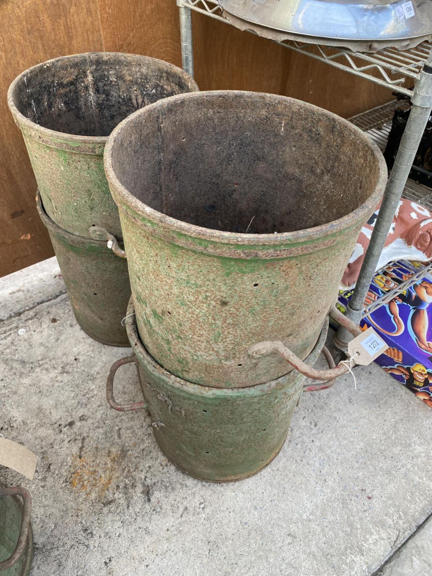 FOUR VINTAGE CAST IRON CHEESE VATS