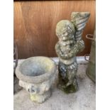 A RECONSTITUTED STONE CHERUB FIGURE AND A FURTHER RECONSTITUTED STONE URN