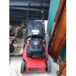 A CHAMPION PETROL LAWN MOWER