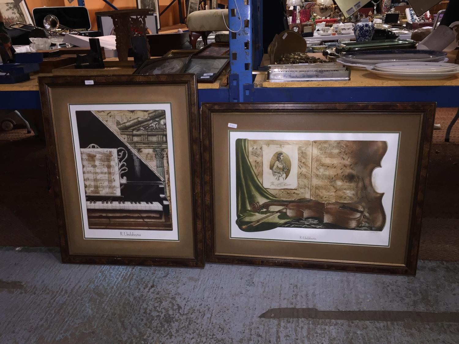 TWO WOODEN FRAMED, MUSIC THEMED, 'R. UNDABEYTIA' PRINTS
