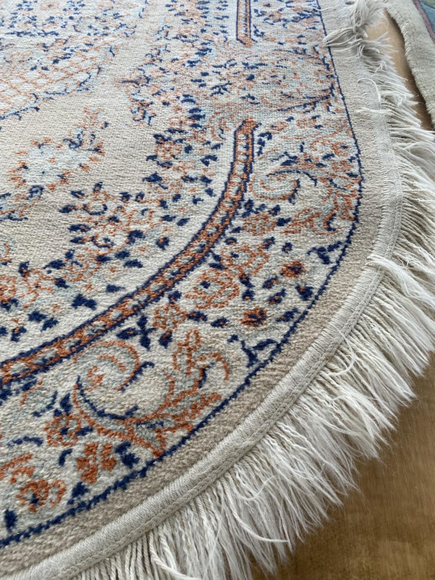 AN OVAL CREAM PATTERNED RUG - Image 2 of 3