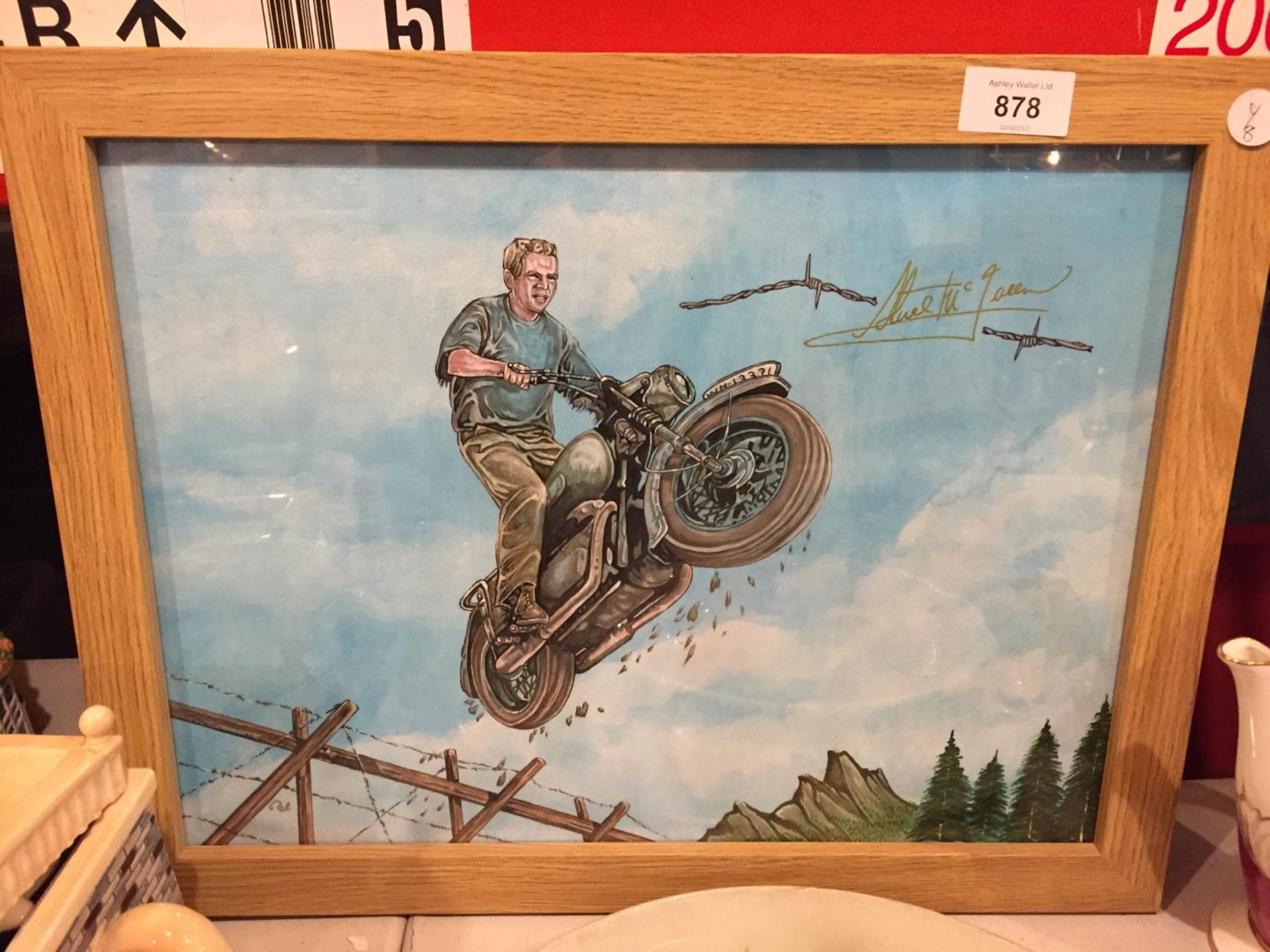 A FRAMED PAINTING OF STEVE McQUEEN IN THE GREAT ESCAPE BY ROB BERESFORD