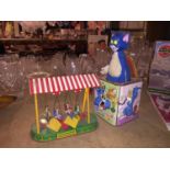 A VINTAGE TIN PLATE FAIRGROUND RIDE, NEEDS TLC BUT DOES WORK, AND A VINTAGE TOM AND JERRY JACK IN