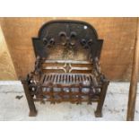 A VINTAGE CAST IRON FIRE GRATE