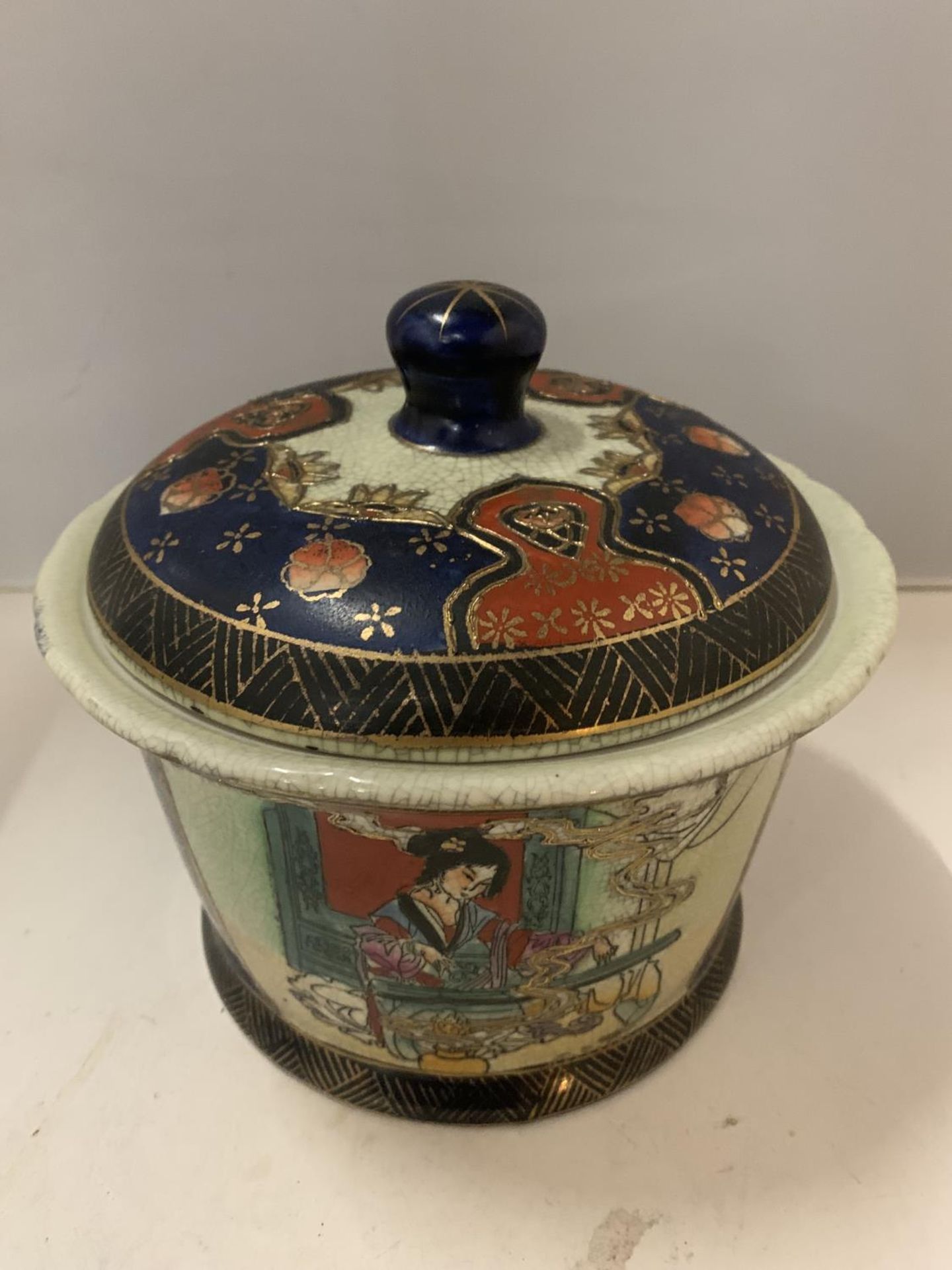 AN ORIENTAL SATSUMA LIDDED POT