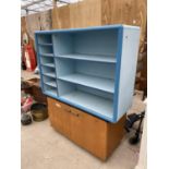 A TWO DOOR CUPBOARD AND A FURTHER SHELVING UNIT