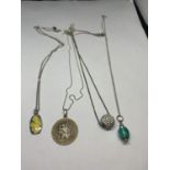FOUR MARKED SILVER NECKLACES WITH PENDANTS TO INCLUDE A CLEAR STONE CHARM, ST CHRISTOPHER ETC