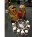 TWO WOODEN RUSSIAN DOLLS TOGETHER WITH SEVEN CHINA THIMBLES AND GLASS TRINKET DISH