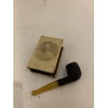 A MATCHBOX COVER 'BLIGHTY 1918' AND A SMALL PIPE
