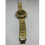 A DECORATIVE YELLOW METAL AND CLEAR STONE FASHION WRIST WATCH