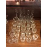 AN AMOUNT OF CUT GLASS GLASSES TO INCLUDE, CHAMPAGNE FLUTES, SHERRY, WHISKEY TUMBLERS, ETC