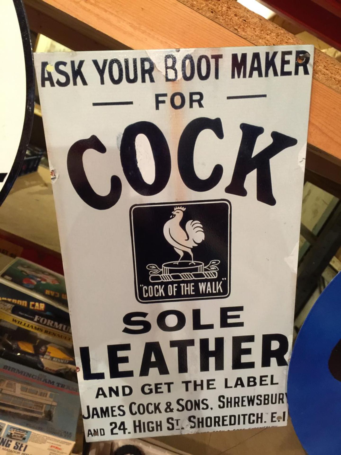 A METAL SIGN ADVERTISING SOLE LEATHER