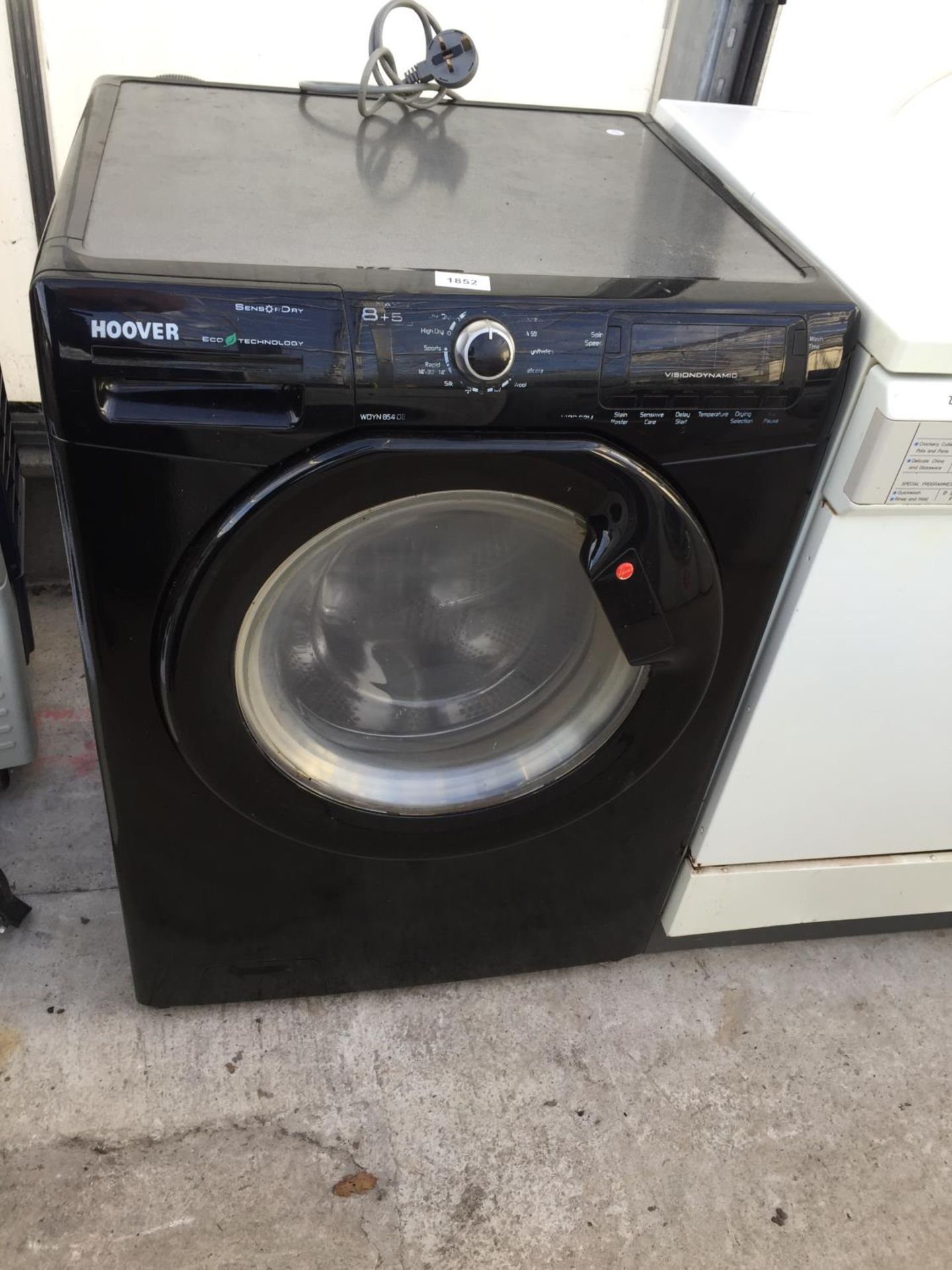 A BLACK HOOVER WASHER DRYER