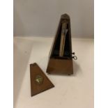 A MAHOGANY CASED METRONOME