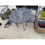 A CAST ALLOY BISTRO SET TWO INCLUDE A ROUND TABLE AND TWO CHAIRS