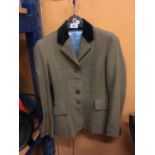 AN EQUIPORT SIZE 8 SHOWING JACKET, TWEED STYLE PATTERN, UNION JACK BADGE ON THE ARM, BACK VENTS,