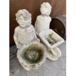 TWO RECONSTITUTED STONE CHERUB FIGURES WITH PLANTER SECTIONS
