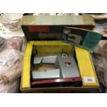 A BOXED VINTAGE VULCAN CLASSIC CHILD'S ELECTRIC SEWING MACHINE