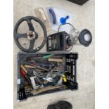 AN ASSORTMENT OF ITEMS TO INCLUDE A STEERING WHEEL, A JUICER AND TOOLS ETC