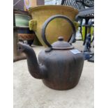 A VINTAGE ANTIQUE CAST IRON KETTLE