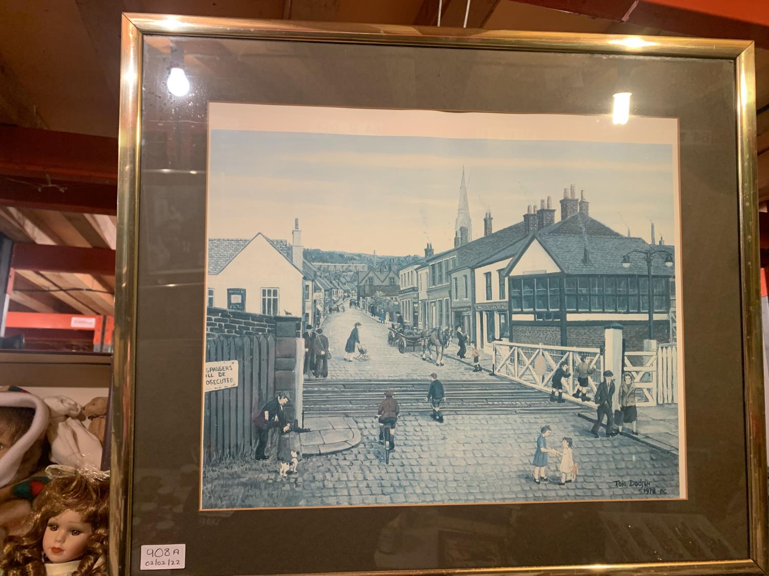 A FRAMED SIGNED TOM DODSON PRINT 'THE LEVEL CROSSING, RAMSBOTTOM' 62 CM X 54 CM